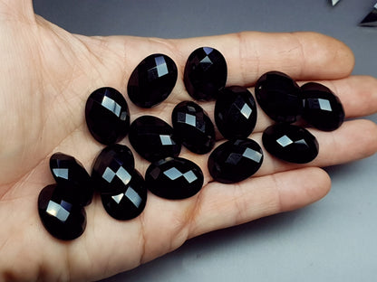 Faceted black agate cabochon - oval - 20 mm