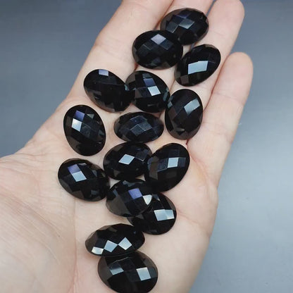 Faceted black agate cabochon - oval - 20 mm