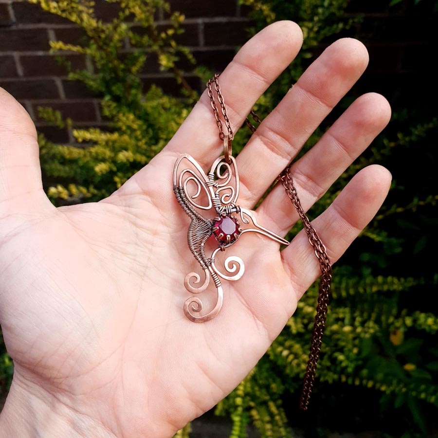 humming bird garnet pendant imbali crafts