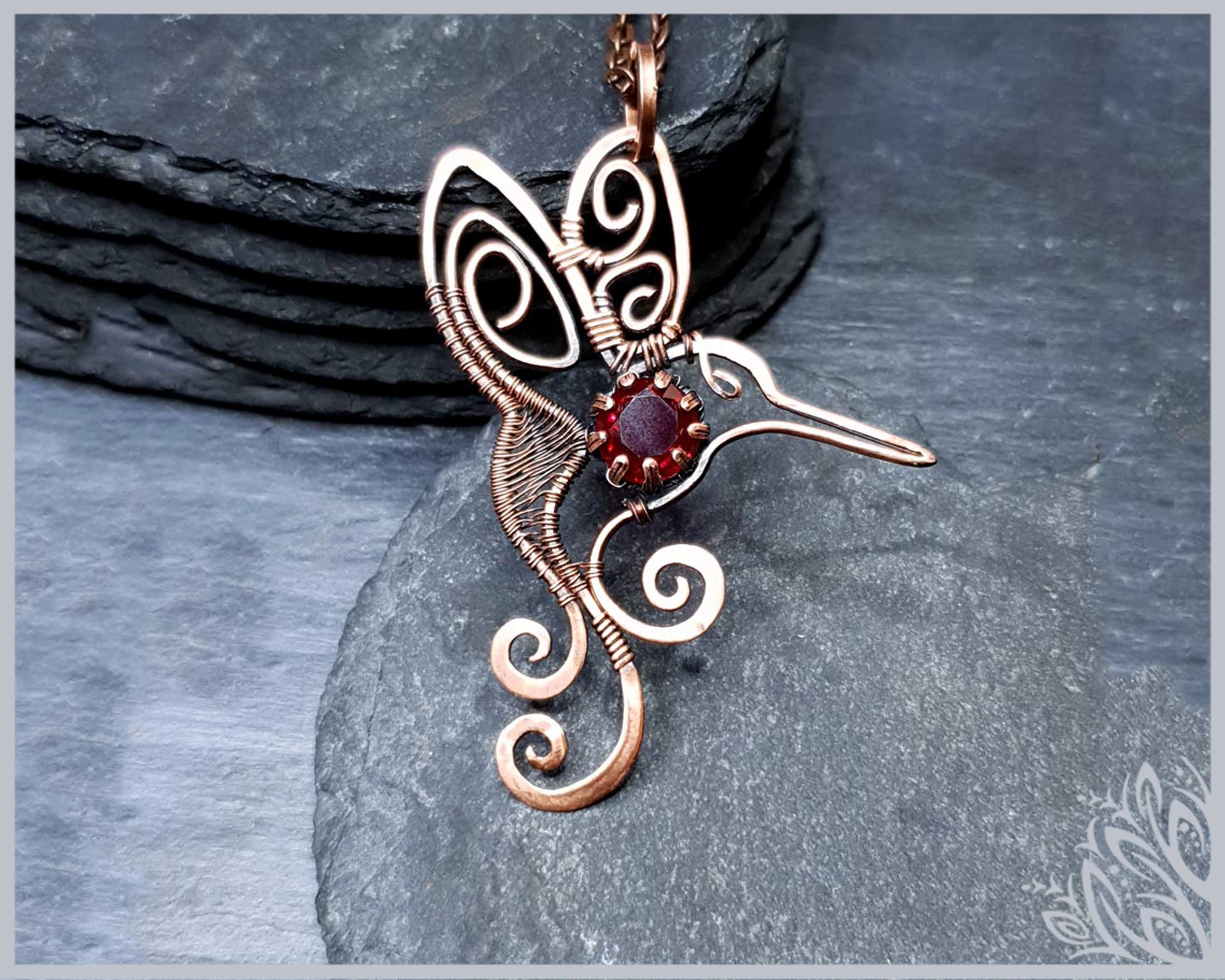 humming bird garnet pendant imbali crafts