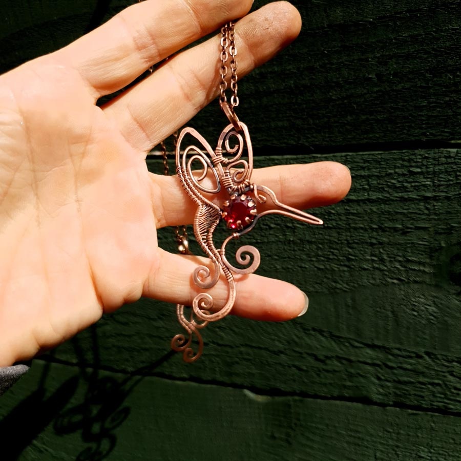 humming bird garnet pendant imbali crafts